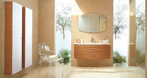 A taupe bathroom with rich colored wood items, greenery in the shower and an acrylic chair
