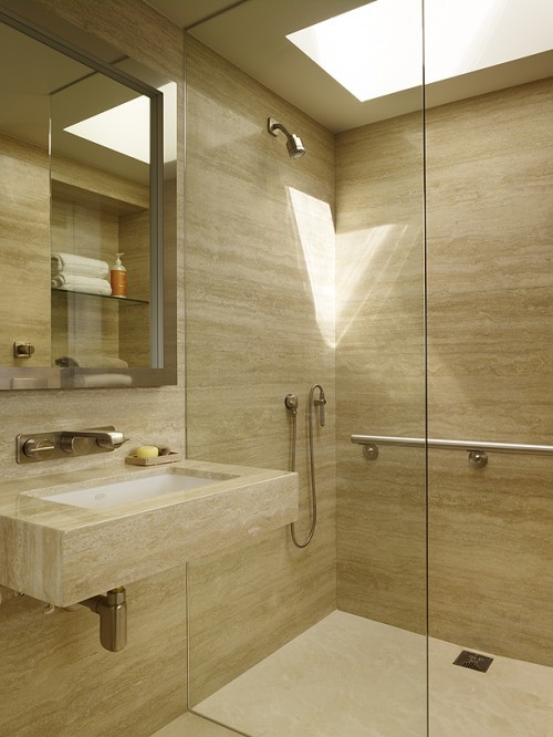 a contemporary bathroom done with plywood panels completely pulls off the wood in the bathroom trend