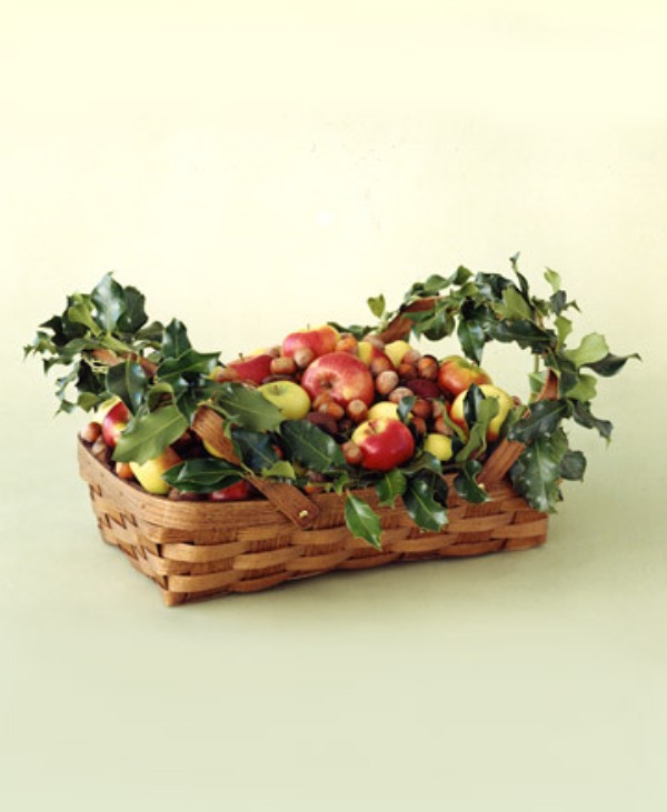 A basket with apples, berries, greenery and fresh fruits is a very easy and truly natural centerpiece idea for Thanksgiving