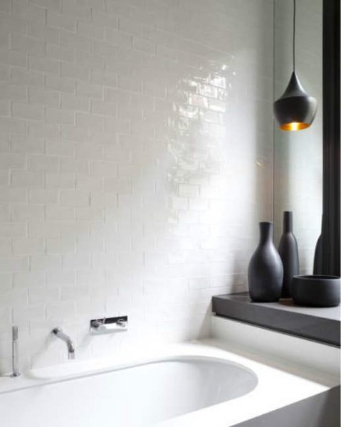 For a white bathroom you could use black pendant lights and black decor items, like vases, to make it more interesting.