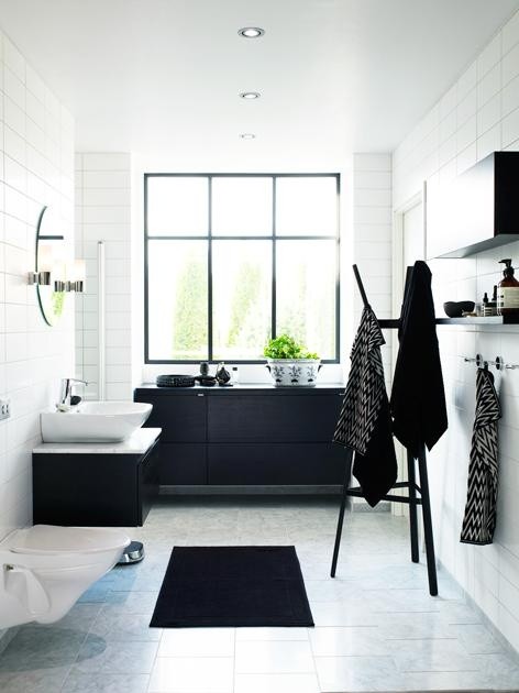 Another way to go is to make all bathroom storage black while everything else - white.