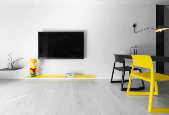 Black andwhite minimalist apartment with pops of yellow  3