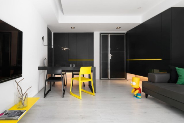 Black andwhite minimalist apartment with pops of yellow  9