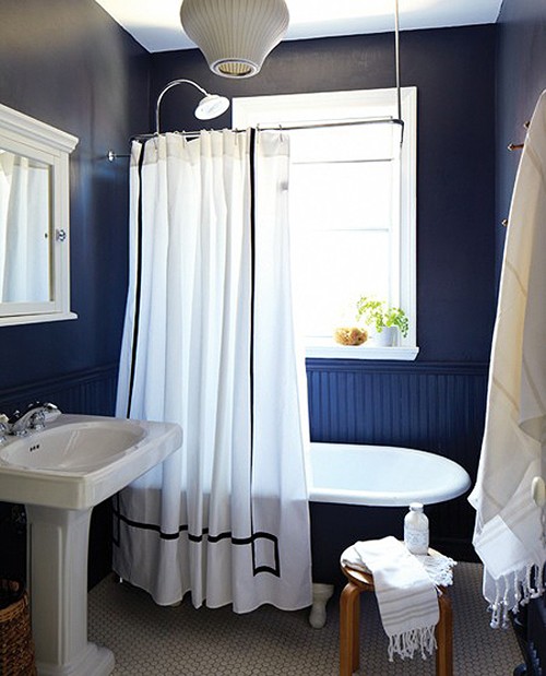 navy walls done with beadboard and paint are spruced up with bright white touches and decor