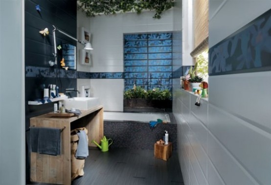 patterned blue tiles on the walls in a neutral bathroom and a wooden vanity for a contemporary bathroom