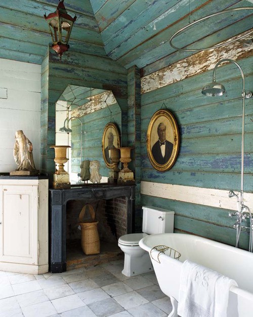 a neutral and turquoise bathroom covered with weathered wooden planks for a shabby chic space