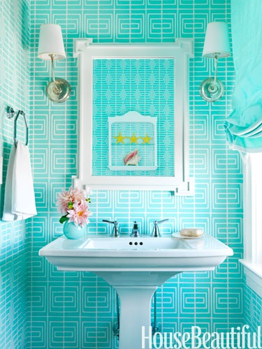 bold wallpaper is a trendy decor idea, and turquoise and white printed wallpaper in a powder room is a chic idea