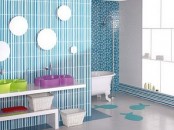 a modern bright blue bathroom with catchy mirrors and colorful sinks for kids