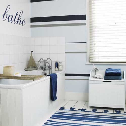 a striped navy and white rug and navy towels may be a nice addition to your bathroom