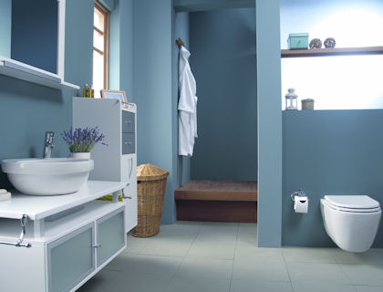 a contemporary matte blue bathroom with touches of white and white furniture