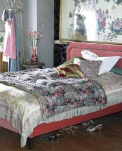 a glam girlish bedroom with a floral accent wall, a pink bed with floral bedding, pastel textiles and blooms is an amazing space