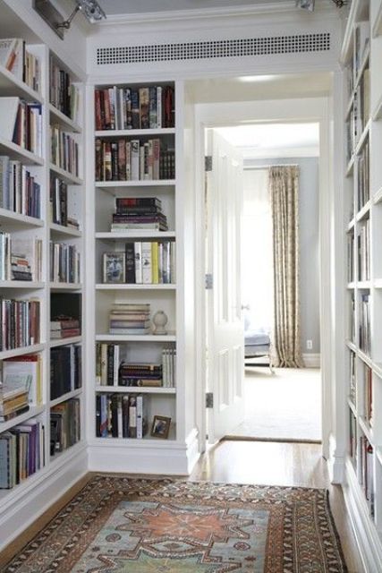 A corridor with built in bookshelves on both sides is a stylish idea that will save much space and store all your books