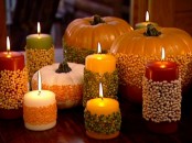 colorful candles wrapped with corn and peas are great for decorating for the fall and harvest time and you can easily make them