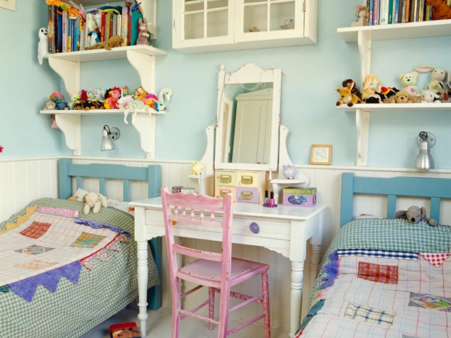 Charming country style small room for two girls. Lovely makeup table and a pink chair are a perfect  combo.
