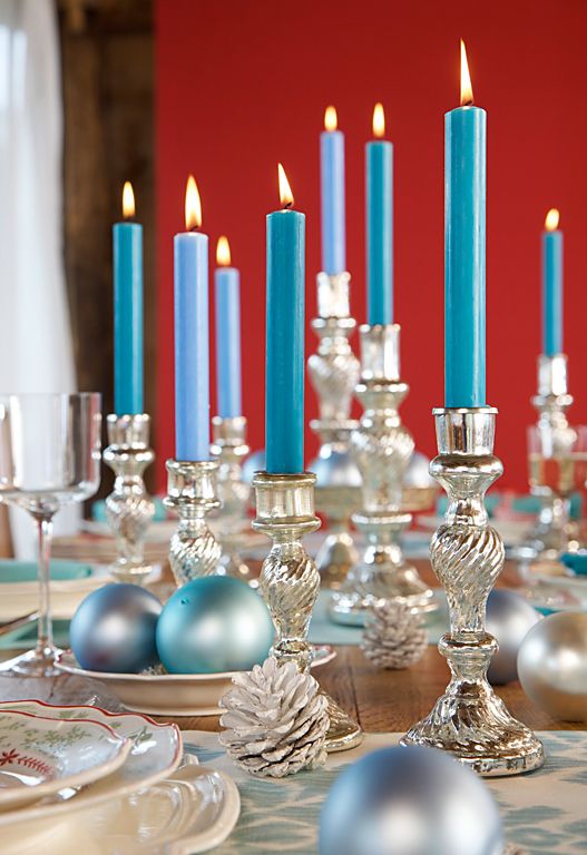 silver candleholders and pinecones, blue candles and blue and silver ornaments will make your Christmas tablescape feel and look frozen