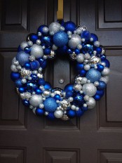 a bright Christmas wreath of ornaments – blue, electric blue and silver ones is a bright and cool idea for a frozen feel