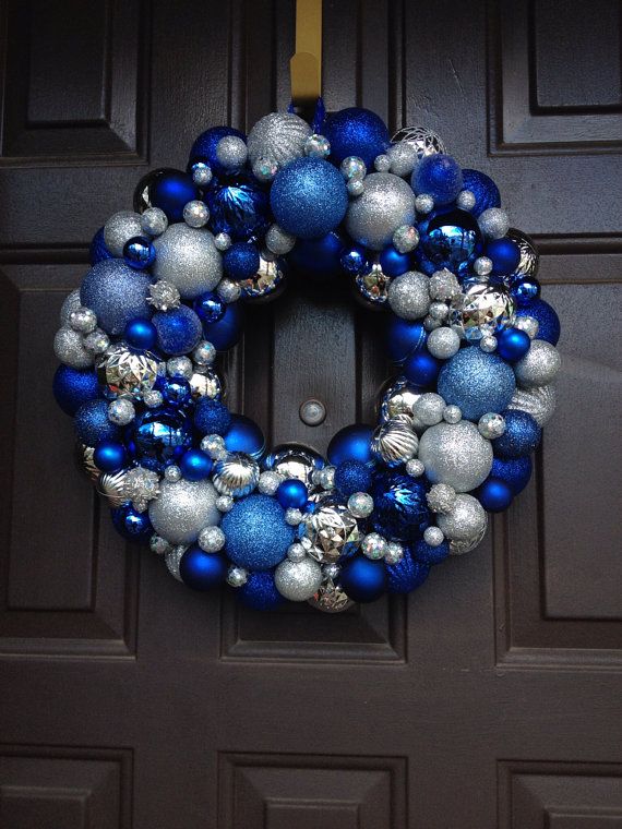 A bright Christmas wreath of ornaments   blue, electric blue and silver ones is a bright and cool idea for a frozen feel