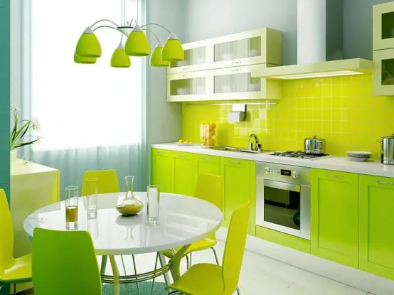 a neon kitchen with neon green cabinets, a neon yellow backsplash and a matching dining zone and a chandelier