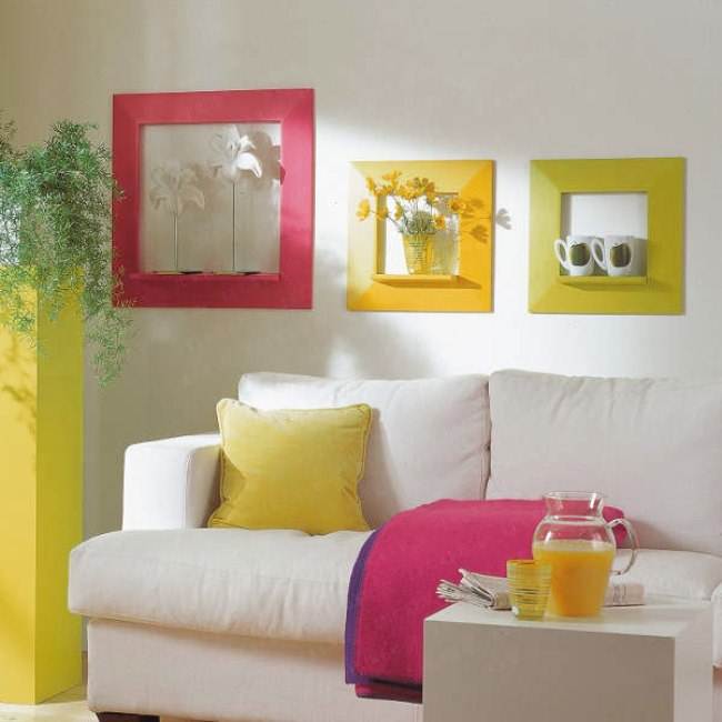 Bold textiles, a sunny yellow plant stand and colorful frames enliven the living room making it feel summer like