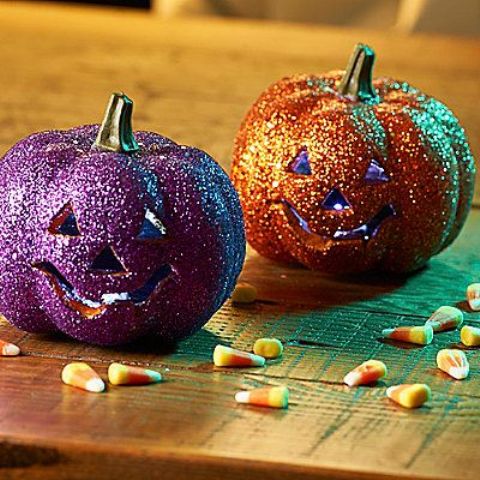 a glitter orange and purple jack-o-lantern are chic and refined, with a bright and shiny touch for Halloween decor