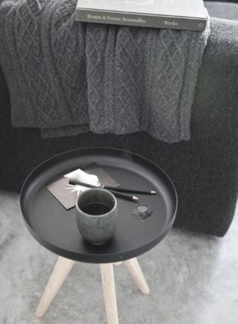 a grey knit blanket, a matte black and wood side table plus matching tableware for the fall and winter