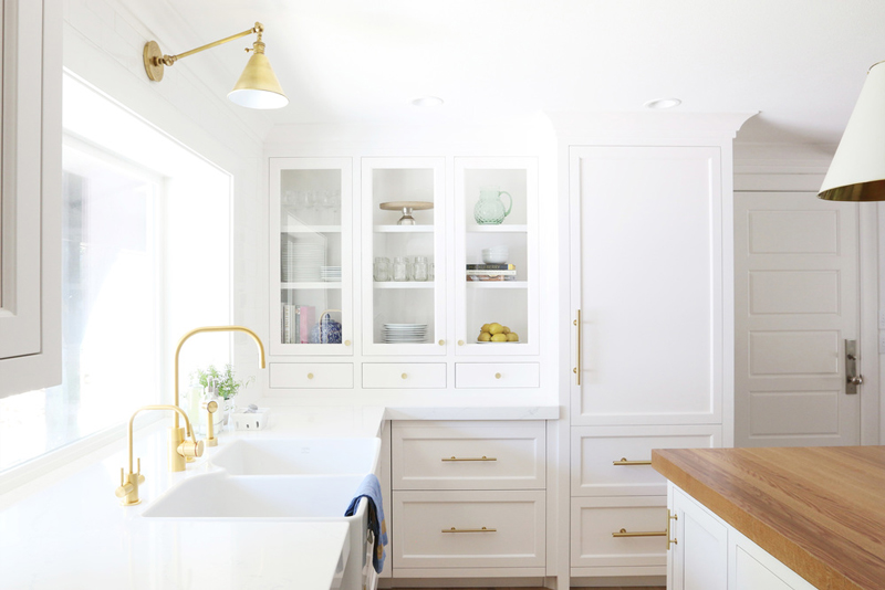 Chic white kitchen remodel with brass touches  2