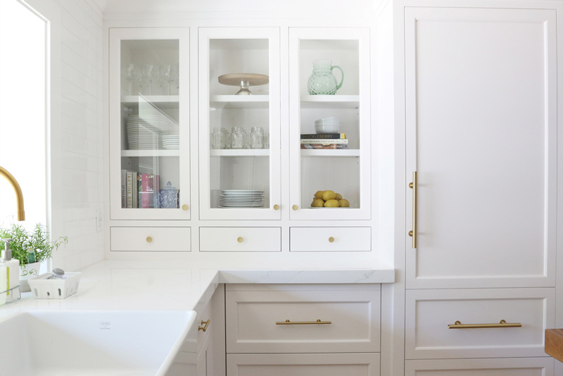 Chic white kitchen remodel with brass touches  3
