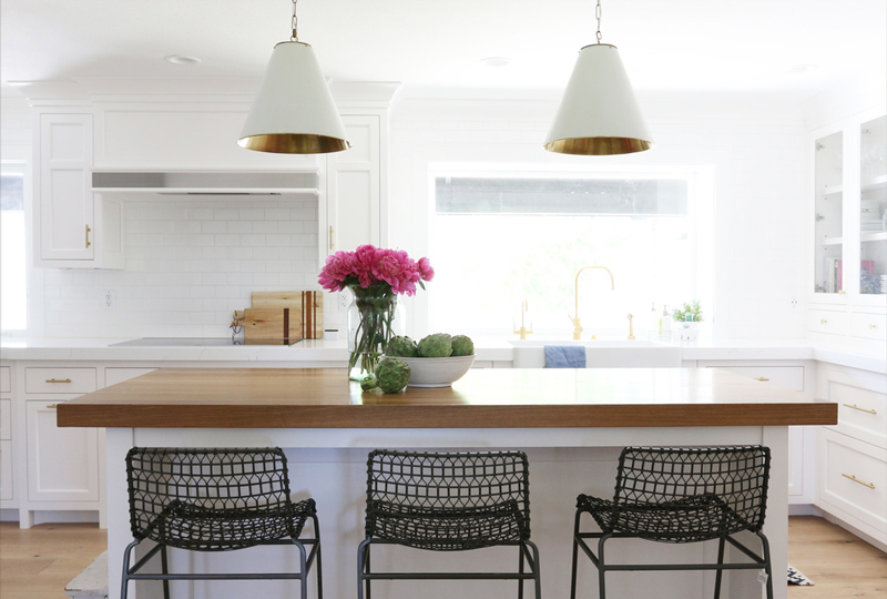 Chic white kitchen remodel with brass touches  4