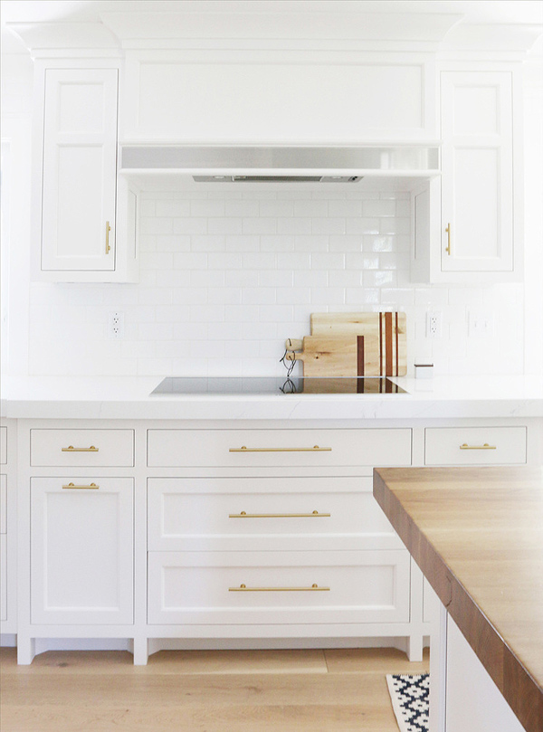 Chic white kitchen remodel with brass touches  5