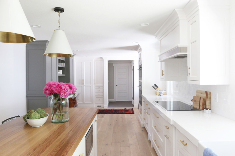 Chic white kitchen remodel with brass touches  6