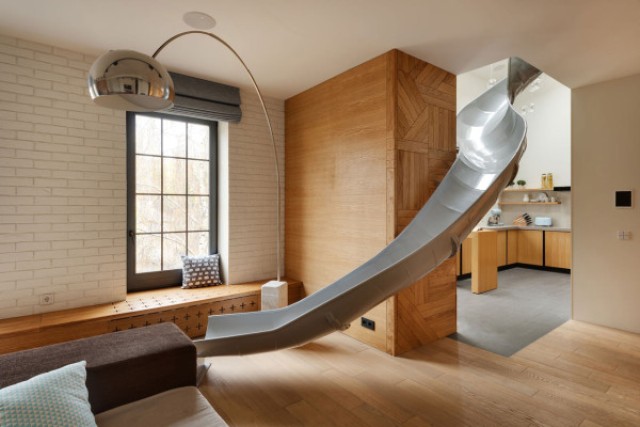 Childhood fantasies come true modern apartment with a slide  9