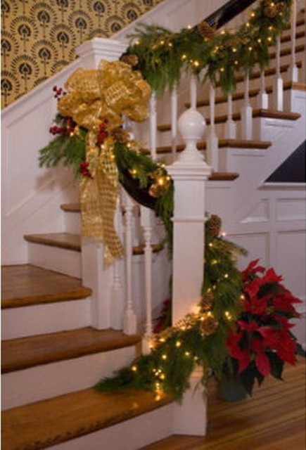 Don't forget to add some lights to evergreen garlands on your staircase. Just make sure they are small and invisible.