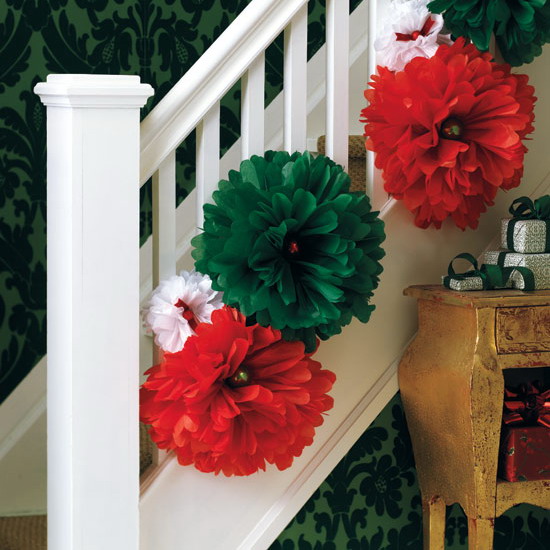 Here is a super simple and quick way to dress up the staricase. Simply hang a bunch of oversized flowers on banisters. Just make sure they are in different sizes and have seasonal colors.