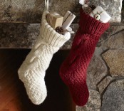 simple red and white knit stockings with gift boxes, pinecones and bells will make your space naturally festive and very cozy