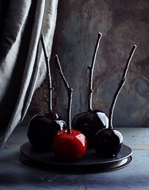 Minimalist Halloween treats   black and red candied apples on sticks are amazing for making your guests and family happy