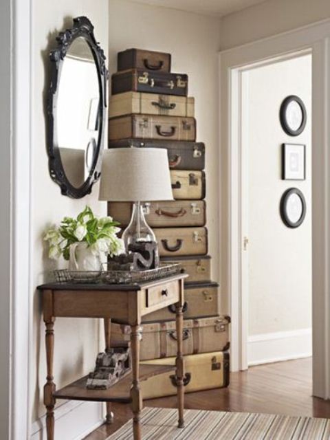 Reusing vintage suitcases is a cool idea to make a decorative storage solution.