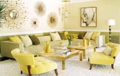 a bright spring living room with a neutral sofa, yellow chairs, green and yellow pillows and sunburst mirrors and artworks