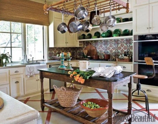 a bright tile backsplash and yellow cabinets plus some vintage furniture
