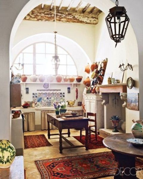 colorful rugs, tiles and porcelain make this neutral boho kitchen bright