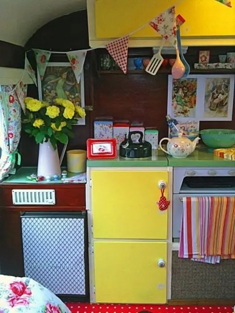 a burgundy and sunny yellow kitchen plus green countertops and fabric buntings