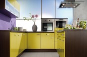 a bold kitchen with lemon yellow and brown cabinets, a purple backsplash and stainless steel appliances is modern and bold
