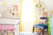 a cute girl nursery design with lots of colors