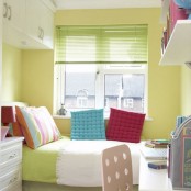 a small colorful teen room or dorm room done in neon yellow, with bright bedding and colorful pillows and shelves with bold books