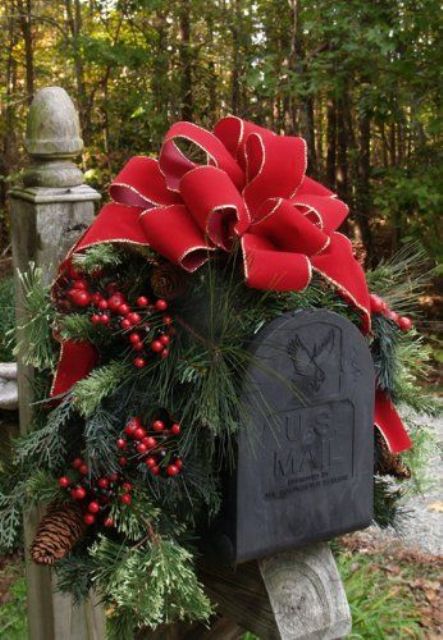 decorate your mail box with a red bow, fir branches, berries and pinecones for a cozy rustic outdoor feel