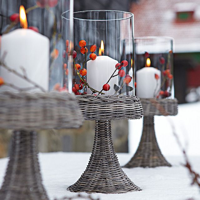 Vintage candleholders with berries and candles can light up your front porch or some other space