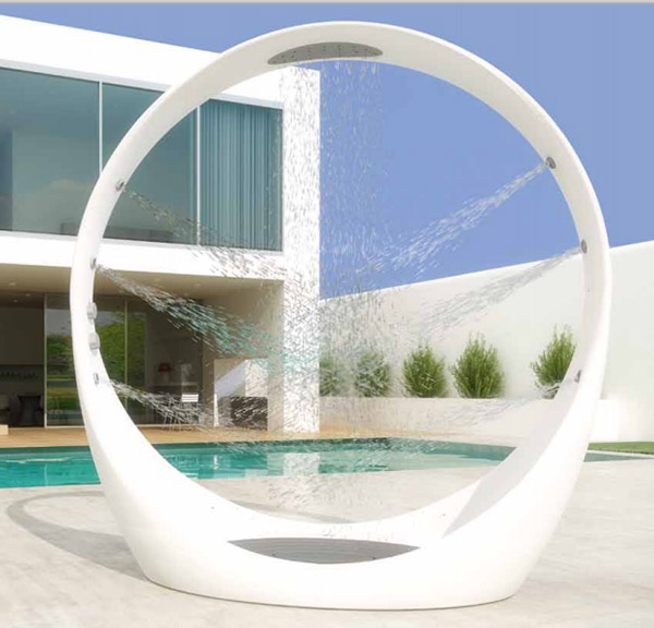 A unique and ultra modenr outdoor round shower with shower heads built in all around is a veyr fresh and bold idea