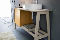 a stylish and functional mid-century modern sink stand with a storage cabinet and an open shelf is a lovely idea for a modern bathroom