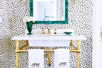 a gold frame sink stand is a pretty idea for an art deco, modern or glam bathroom, it will add a bit of shine to the space