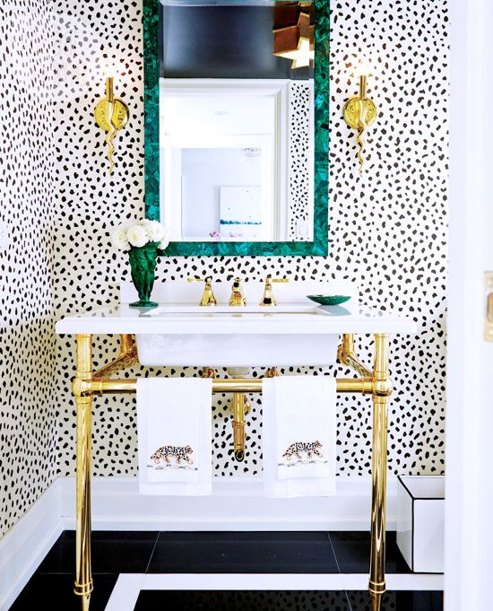 a gold frame sink stand is a pretty idea for an art deco, modern or glam bathroom, it will add a bit of shine to the space