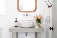 a rough concrete sink stand or vanity is a cool industrial solution for a modern or contemporary bathroom that will add a modern and edgy feel to your space